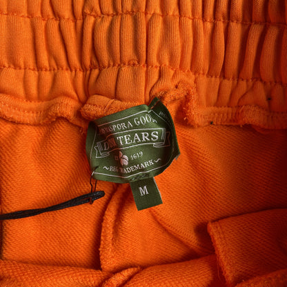 DENIM TEARS COTTON WREATH SWEATPANTS ORANGE