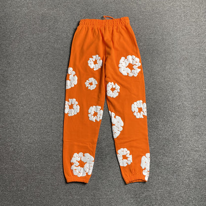 DENIM TEARS COTTON WREATH SWEATPANTS ORANGE